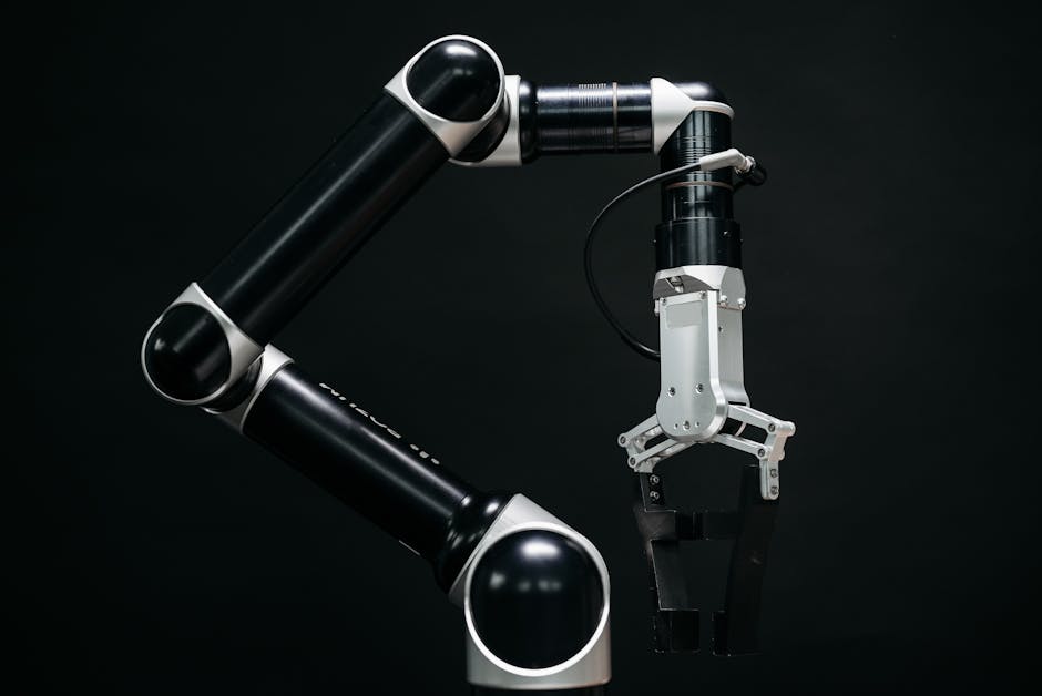 Close-up of a mechanical robotic arm with a dark background, showcasing advanced technology.