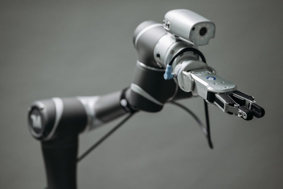 Close-up view of a robotic arm equipped with a video camera, showcasing modern technology.