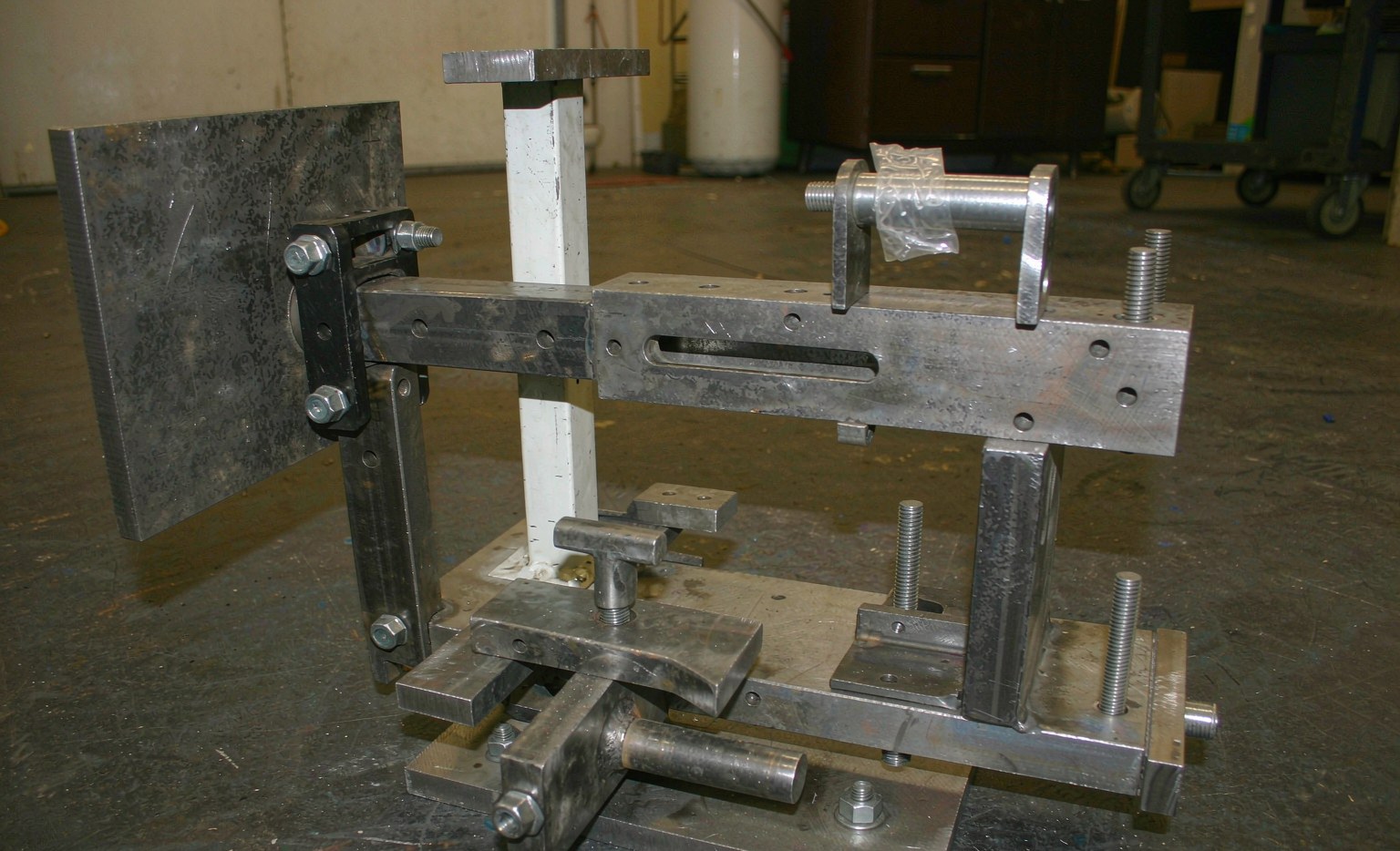 Clamped welded assembly in a fixture on a cell