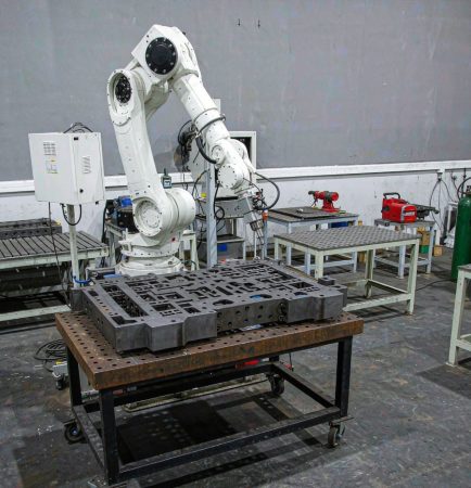 Robotic laser welding cell with a six-axis robot and fiber laser head